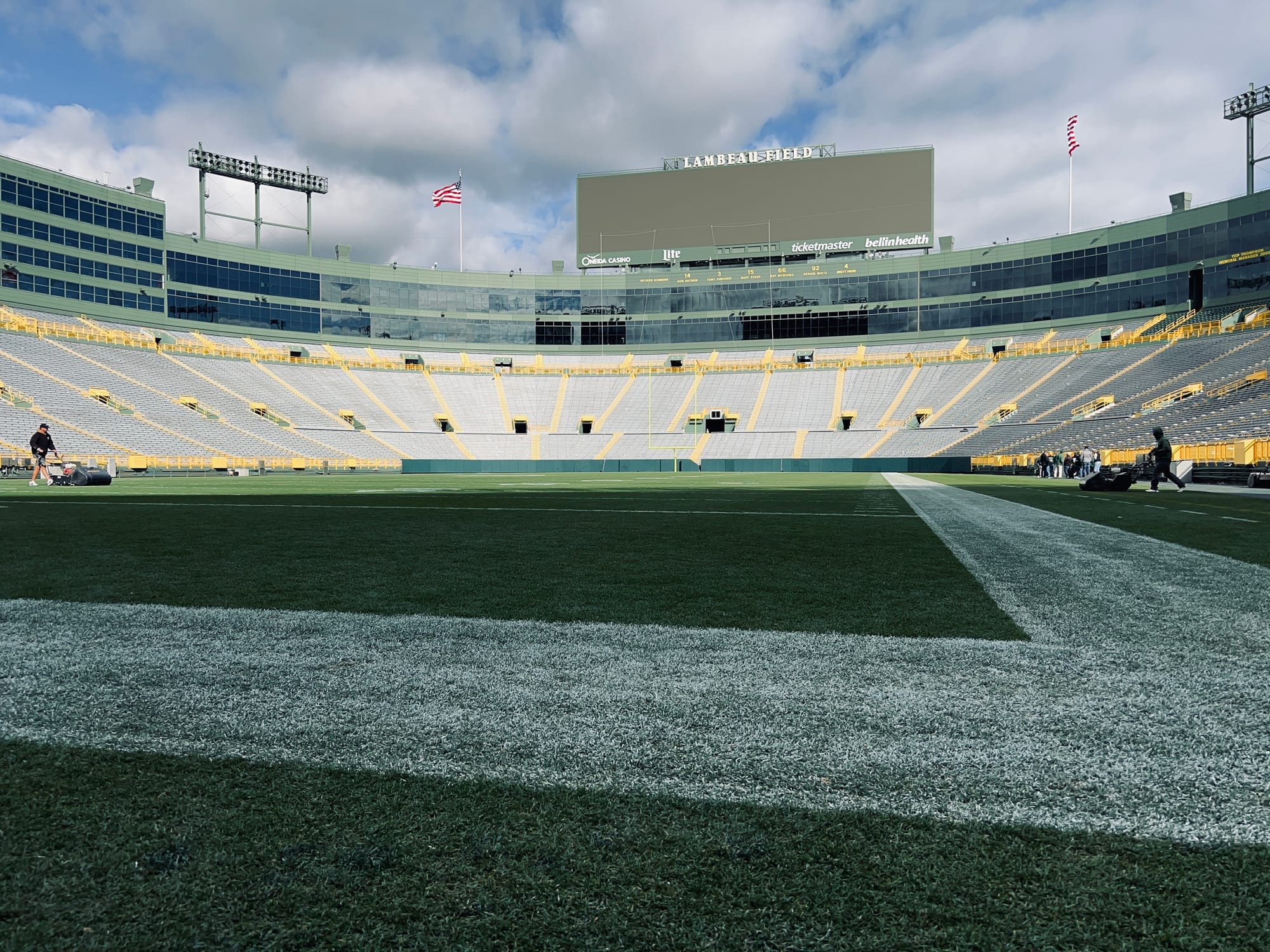 grass field, markings, signs, bleachers