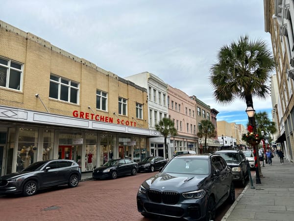 cars, sidewalk, brick, signs, palm trees, architecture